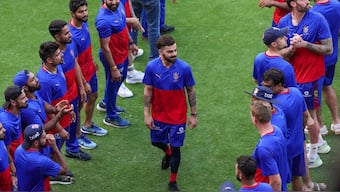 Royal Challengers Bangalore men's team player Virat Kohli with teammates during the RCB Unbox event at the M Chinnaswamy Stadium in Bengaluru. PTI