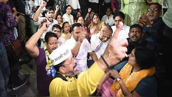 Aam Aadmi Party workers shout slogans as Enforcement Directorate arrived to arrest Arvind Kejriwal at his residence, in New Delhi on Thursday. Kejriwal was arrested in the alleged Delhi liqour scam. AP