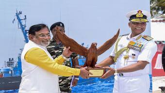Chief of the Naval Staff Admiral R Hari Kumar presents a memento to Lakshadweep Administrator Praful Khoda Patel during the commissioning of naval base 'INS Jatayu', in Minicoy, Lakshadweep Islands. PTI