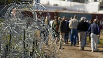 Illegal immigrants clash with Texas' National Guardsmen in an attempt to enter US. AP File