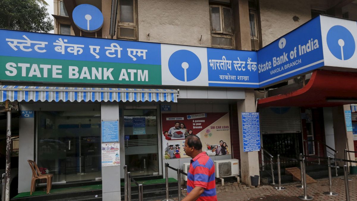 A man walks past a a State Bank of India branch in Mumbai. On Tuesday evening, SBI submitted data about electoral bonds to the Election Commission of India, in line with the Supreme Court order. File photo/Reuters A man walks past a a State Bank of India branch in Mumbai. On Tuesday evening, SBI submitted data about electoral bonds to the Election Commission of India, in line with the Supreme Court order. File photo/Reuters