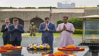 Ukraine's foreign minister Dmytro Kuleba pays homage at the Rajghat in New Delhi. PTI