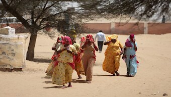 Women cover their faces to protect from heat as they arrive at a polling station to cast their votes during the first phase of the general election, in Bikaner district, Rajasthan, on 19 April 2024. Reuters File Photo