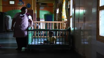 An Indian child cries in its crib at Palna - one of Delhi's oldest adoption agencies and orphanages on on 26 June 2015. AFP File Photo
