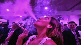 A guest takes a puff from a marijuana cigarette at the Sensi Magazine party celebrating the 420 holiday in the Bel Air section of Los Angeles. File phot/oAP