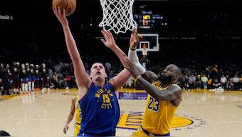 Denver Nuggets center Nikola Jokic (15) shoots against Los Angeles Lakers forward LeBron James (23) during the second half of Game 3 of their NBA playoffs tie. AP 