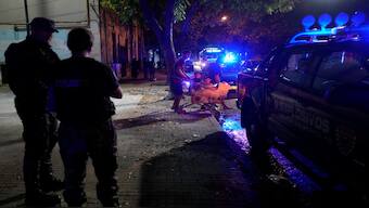 Police patrol the streets of Rosario, Argentina. AP