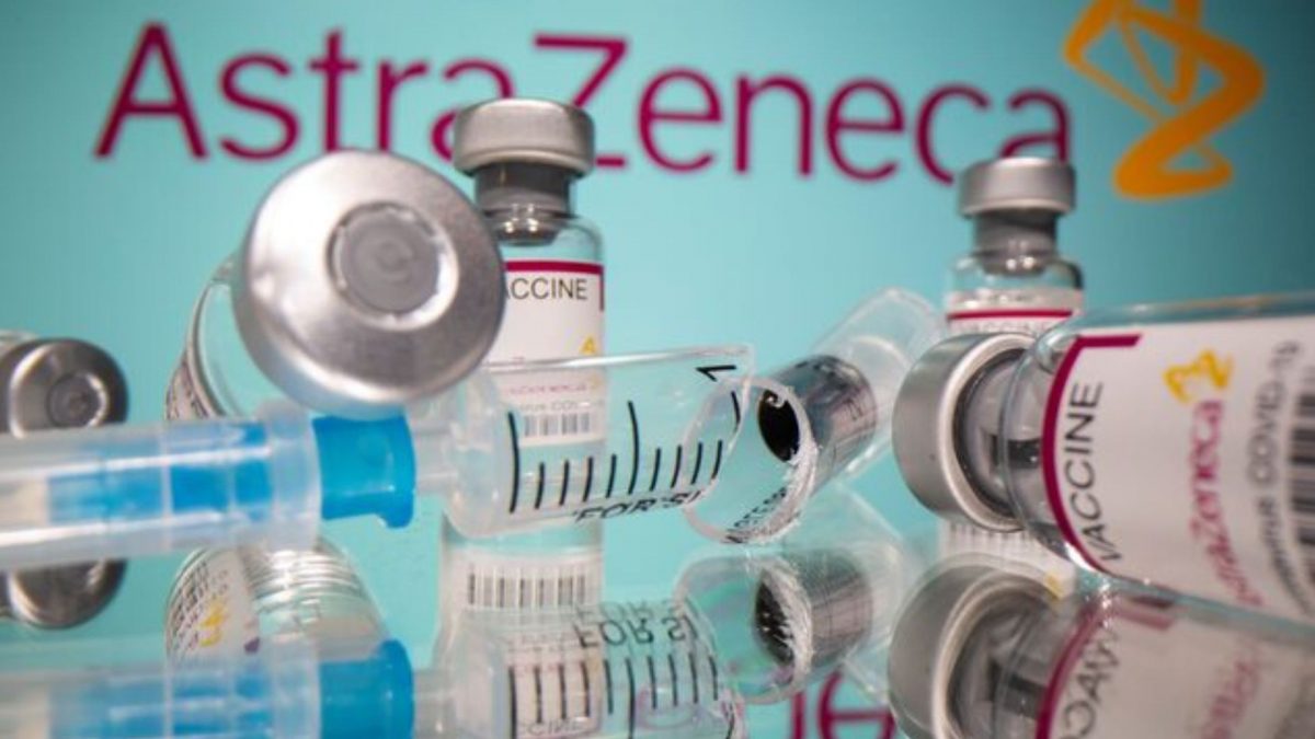 Vials labelled "AstraZeneca COVID-19 Coronavirus Vaccine" and a broken syringe are seen in front of a displayed AstraZeneca logo. REUTERS.  Vials labelled "AstraZeneca COVID-19 Coronavirus Vaccine" and a broken syringe are seen in front of a displayed AstraZeneca logo. REUTERS.