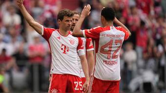 Bayern's Thomas Mueller (L) celebrates after scoring his side's second goal against Cologne in the Bundesliga. AP
