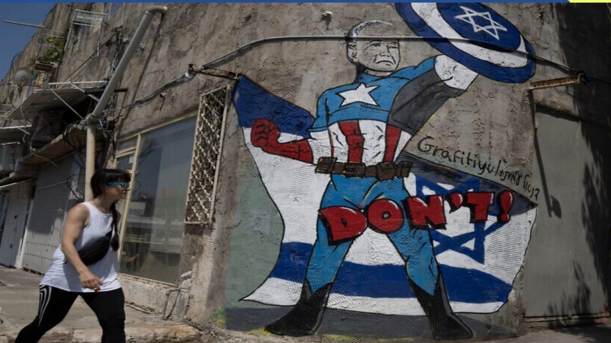 A person walks past a mural depicting the US president Joe Biden as a superhero defending Israel on a street in Tel Aviv, Israel. AP A person walks past a mural depicting the US president Joe Biden as a superhero defending Israel on a street in Tel Aviv, Israel. AP
