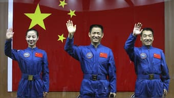 The three astronauts who are stationed at Tiangong, China's own space station that it built in under a decade. Image Credit: Reuters