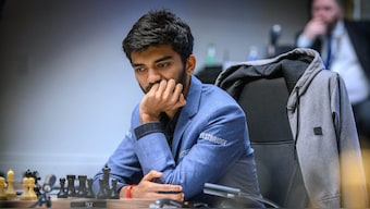 Indian Grandmaster D Gukesh in action against USA's Hikaru Nakamura during Round 14 of the 2024 Candidates Chess Tournament. PTI via FIDE/Michal Walusza