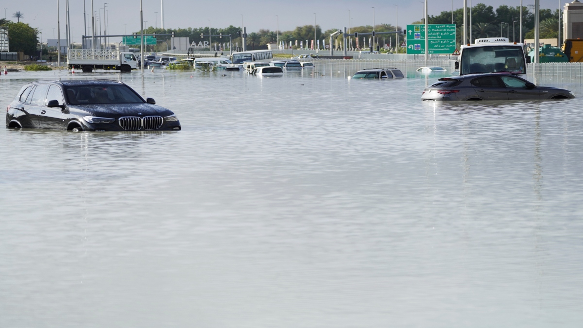 Vehicles sit abandoned in floodwater covering a major road in Dubai, United Arab Emirates, on Wednesday. AP Vehicles sit abandoned in floodwater covering a major road in Dubai, United Arab Emirates, on Wednesday. AP