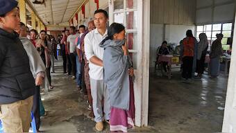 Angami Nagas stand in queues to cast their votes in Chedema village, in Nagaland, on 19 April, 2024. AP