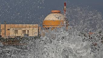 (File) Sea waves hit the rocks as Kudankulam nuclear power project plant is seen in the background in Tamil Nadu. Reuters