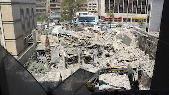 An excavator clears rubble after a suspected Israeli strike on Iran's consulate, adjacent to the main Iranian embassy building, which Iran said had killed seven military personnel including two key figures in the Quds Force, in the Syrian capital Damascus, on 2 April, 2024. Reuters