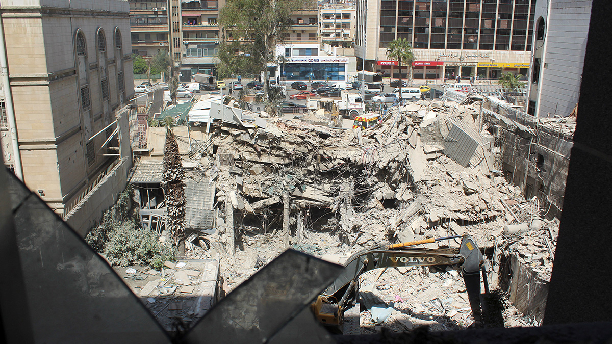 An excavator clears rubble after a suspected Israeli strike on Iran's consulate, adjacent to the main Iranian embassy building, which Iran said had killed seven military personnel including two key figures in the Quds Force, in the Syrian capital Damascus, on 2 April, 2024. Reuters An excavator clears rubble after a suspected Israeli strike on Iran's consulate, adjacent to the main Iranian embassy building, which Iran said had killed seven military personnel including two key figures in the Quds Force, in the Syrian capital Damascus, on 2 April, 2024. Reuters