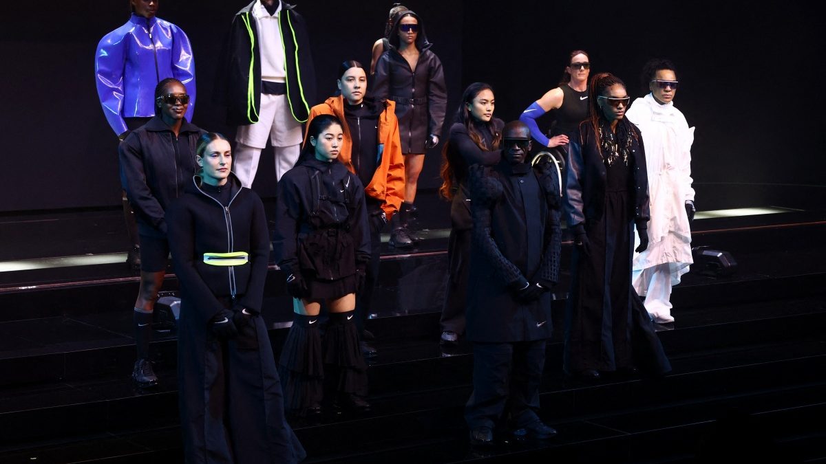 Athletes pose on stage during the unveiling of the products for Olympics. Reuters Athletes pose on stage during the unveiling of the products for Olympics. Reuters
