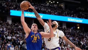 Los Angeles Lakers forward Anthony Davis fights for ball against Denver Nuggets center Nikola Jokic during NBA first-round playoff series. AP