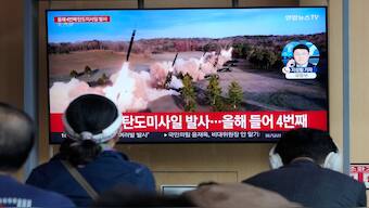 A TV screen shows a file image of North Korea's missiles launch during a news program at the Seoul Railway Station in Seoul, South Korea. AP