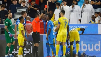 Al Nassr's Cristiano Ronaldo is shown a red card after clashing with Al Hilal's Ali Al Bulayhi in the Saudi Super Cup semi-final. Reuters