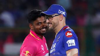 Rajasthan Royals captain Sanju Samson with Royal Challengers Bengaluru skipper Faf du Plessis in IPL 2024. AP