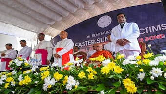 The Vatican ambassador to Colombo, Archbishop Brian Udaigwe (3L) and Sri Lanka's Cardinal Malcolm Ranjith (4L) take part in a remembrance service during the fifth anniversary of the Easter Sunday suicide attacks, at the St. Anthony's church, in Colombo. AFP