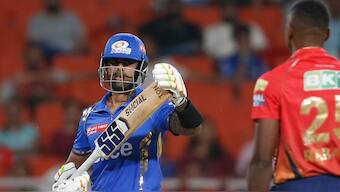 Suryakumar Yadav signals for a review during Mumbai Indians' away clash against Punjab Kings in Mullanpur. AP