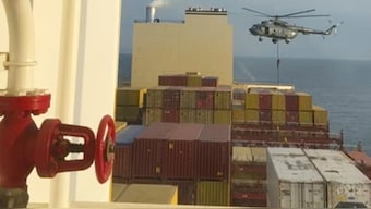 This image from a video provided by a Middle East-based defence official shows a helicopter raid targeting a cargo ship in the Strait of Hormuz on Saturday. It shows commandos raiding the ship in an attack the official attributed to Iran. (Source: AP)