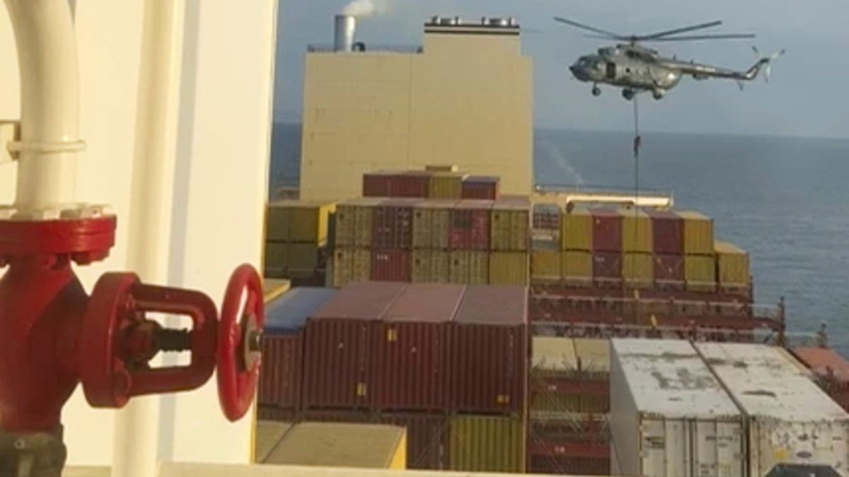 This image from a video provided by a Middle East-based defence official shows a helicopter raid targeting a cargo ship in the Strait of Hormuz on Saturday. It shows commandos raiding the ship in an attack the official attributed to Iran. (Source: AP) This image from a video provided by a Middle East-based defence official shows a helicopter raid targeting a cargo ship in the Strait of Hormuz on Saturday. It shows commandos raiding the ship in an attack the official attributed to Iran. (Source: AP)