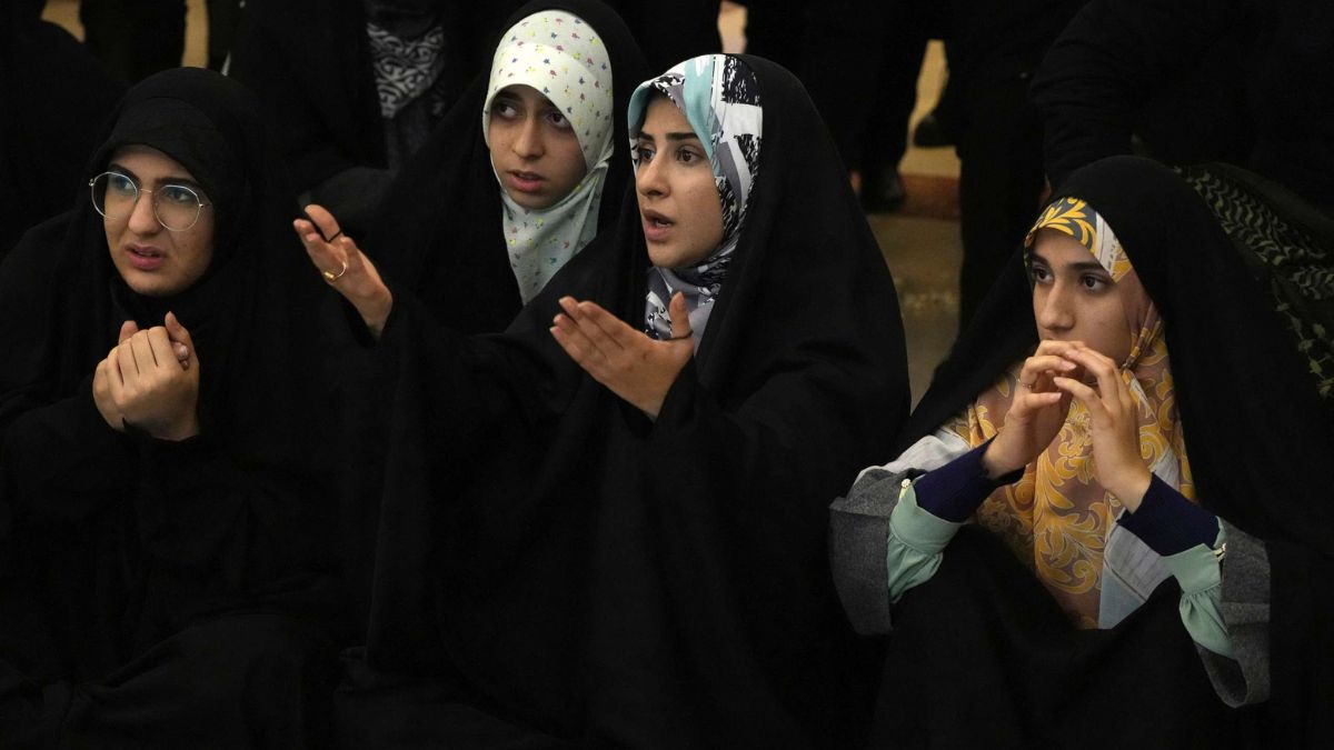 Women are required by law to wear hijab in public in Iran. Source: AP Women are required by law to wear hijab in public in Iran. Source: AP