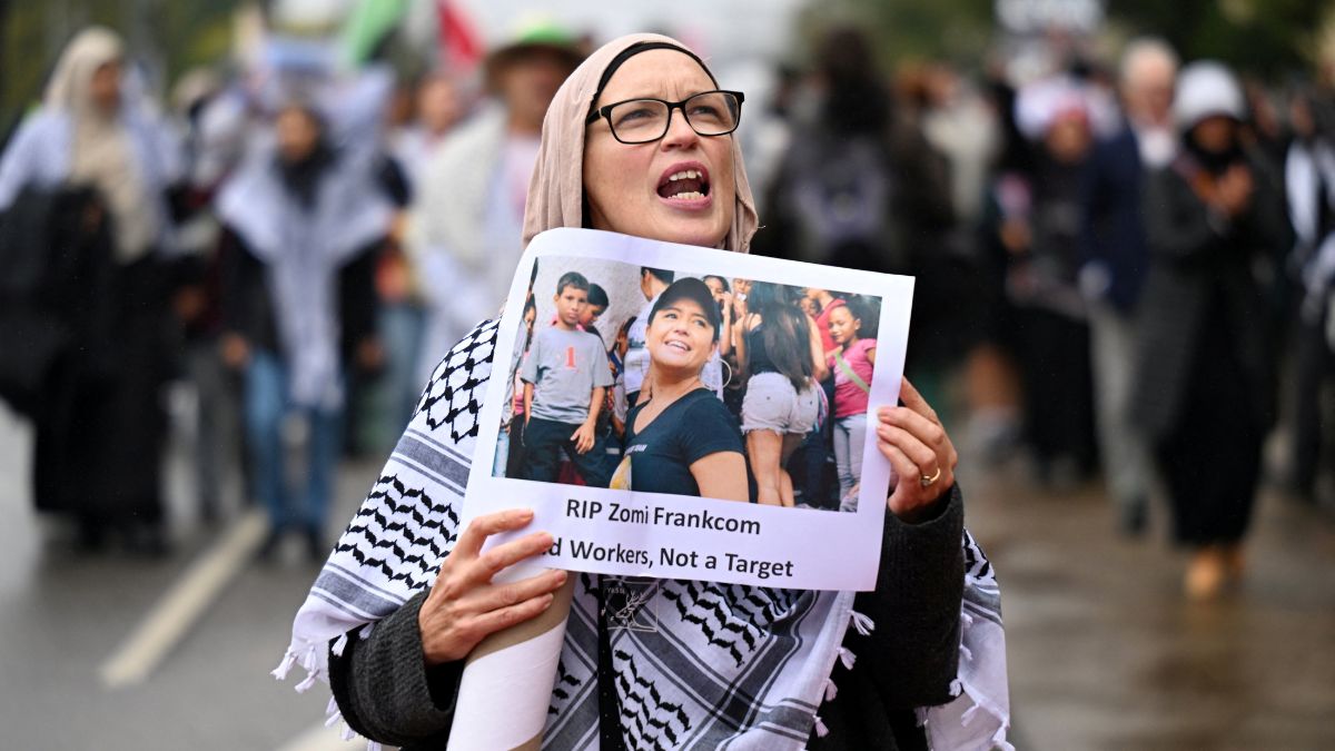 A person holding a placard picturing Australian aid worker Zomi Frankcom marches to the Parliament of Victoria during a a pro-Palestinian demonstration. Reuters A person holding a placard picturing Australian aid worker Zomi Frankcom marches to the Parliament of Victoria during a a pro-Palestinian demonstration. Reuters
