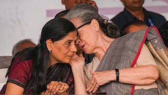 Sunita Kejriwal with Sonia Gandhi. PTI
