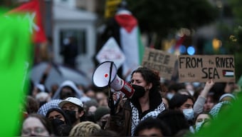 A protester uses a bullhorn as students and others demonstrate at a protest encampment at University Yard in support of Palestinians in Gaza, during the ongoing conflict between Israel and the Palestinian Islamist group Hamas, at George Washington University in Washington, on 25 April 2024. Reuters File Photo