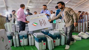 Polling officials collect Electronic Voting Machines (EVM) and other election material at a distribution centre on the eve of the first phase of Lok Sabha elections, in Nagpur. This is India's biggest election and perhaps also its most expensive. PTI