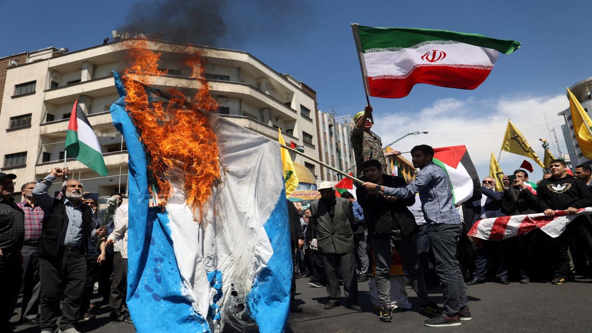 Iranians burn an Israeli flag following a suspected Israeli airstrike on the Iranian embassy complex in the Syrian capital Damascus, in Tehran. Iran has vowed action against Israel for the strike, raising fears of an escalation. File image/Reuters Iranians burn an Israeli flag following a suspected Israeli airstrike on the Iranian embassy complex in the Syrian capital Damascus, in Tehran. Iran has vowed action against Israel for the strike, raising fears of an escalation. File image/Reuters