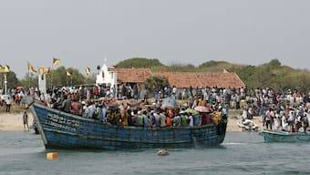 Fishermen from Sri Lanka and India arrive on boats to attend the annual feast of St. Anthony's Church on the island of Katchatheevu. The uninhabited island has become the centre of a controversy with the BJP alleging that the Congress 'gave it away' to Sri Lanka. File image/Reuters