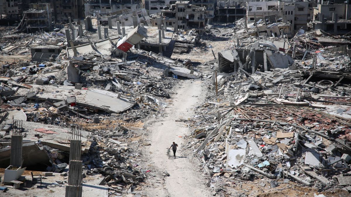 A man pushes a bycicle along as he walks amid building rubble in the devastated area in Gaza, amid the ongoing conflict between Israel and the Palestinian Hamas militant group. AFP A man pushes a bycicle along as he walks amid building rubble in the devastated area in Gaza, amid the ongoing conflict between Israel and the Palestinian Hamas militant group. AFP