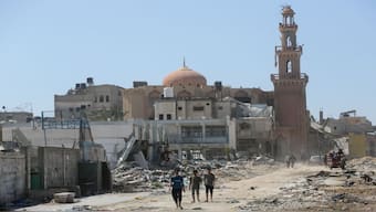 Palestinians inspect destroyed residential buildings and a mosque, after the Israeli military withdrew most of its ground troops from the southern Gaza Strip, amid the ongoing conflict between Israel and Hamas, in Khan Younis, in the southern Gaza Strip. Reuters