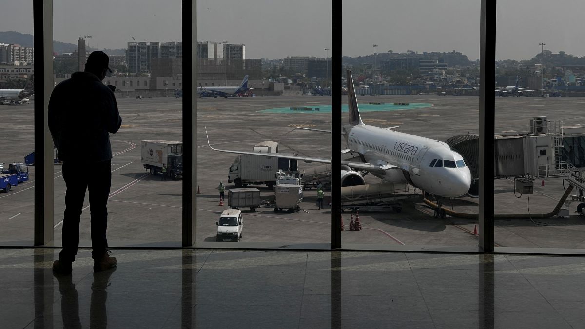 A man takes a picture of a Vistara airline passanger aircraft parked at the Chhatrapati Shivaji Maharaj International Airport in Mumbai. The airline has decided to reduce its capacity by 10 per cent. File photo/Reuters A man takes a picture of a Vistara airline passanger aircraft parked at the Chhatrapati Shivaji Maharaj International Airport in Mumbai. The airline has decided to reduce its capacity by 10 per cent. File photo/Reuters