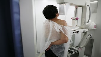 A woman undergoes a  mammogram for breast cancer detection. According to an influential US task force, regular mammograms to screen for breast cancer should start younger, at age 40. File image/Reuters 