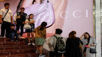 People queue outside a Gucci store in Tsim Sha Tsui, a bustling shopping hotspot, in Hong Kong, China. Reuters