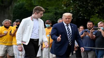 Former US President Donald Trump and his son Barron walk to the White House from Marine One in Washington. Reuters