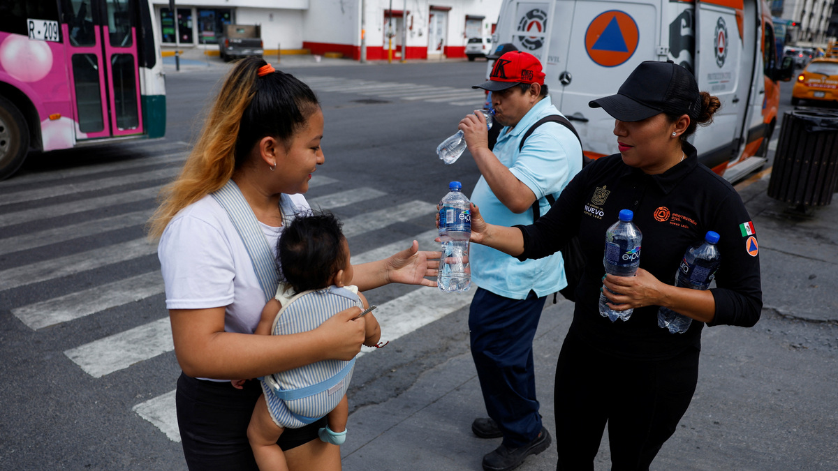 Civil Protection members hand out bottles of cold water during a heat wave, in Monterrey, Mexico. Reuters Civil Protection members hand out bottles of cold water during a heat wave, in Monterrey, Mexico. Reuters