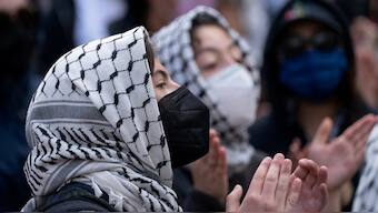 Protestors gather at the gates of Columbia University, in support of student protesters who barricaded themselves in Hamilton Hall, despite orders from university officials to disband or face suspension, during the ongoing conflict between Israel and the Palestinian Islamist group Hamas, in New York City, the US. REUTERS/David Dee Delgado/File Photo