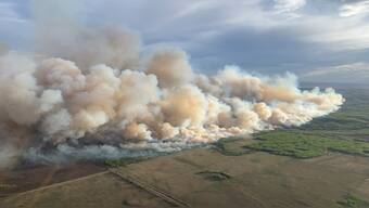 Smoke rises from mutual aid wildfire GCU007 in the Grande Prairie Forest Area near TeePee Creek, Alberta, Canada, 10 May 2024. Reuters