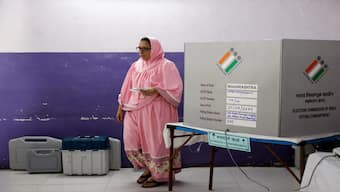 A woman leaves after casting her vote at a polling booth during the fifth phase of India's general election, in Mumbra, on the outskirts of Mumbai on 20 May 2024. Reuters 