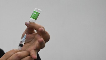 A health worker prepares a Covishield vaccine dose in Kolkata on 10 January  2022. AFP File Photo