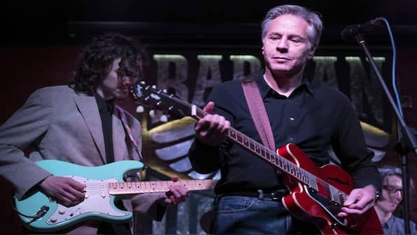 Why is Antony Blinken facing criticism for playing guitar in Ukraine?
