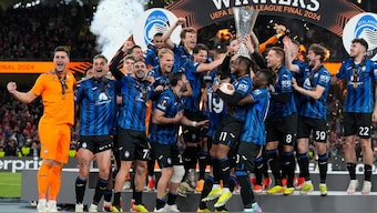 The triumphant Atalanta team pose with the UEFA Europa League trophy. AP 
